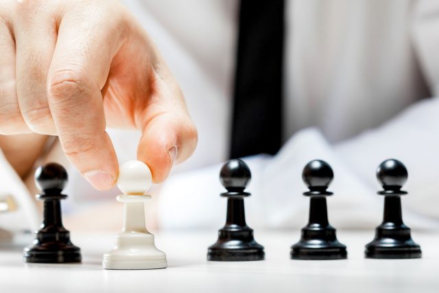 a man is playing a game of chess.